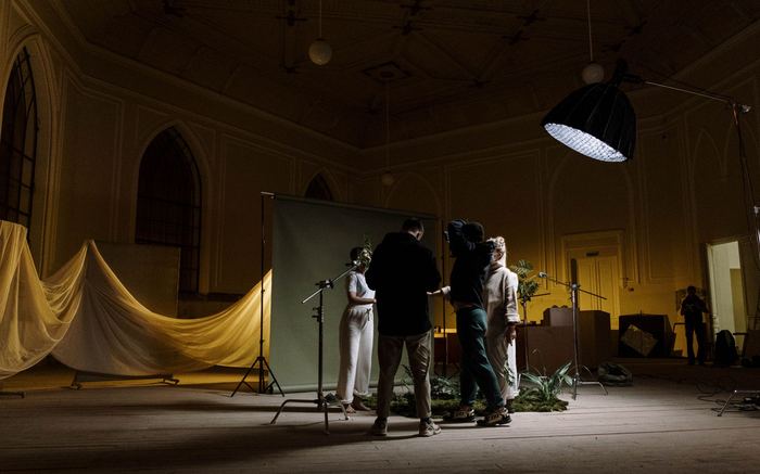 Production crew setting up lighting equipment